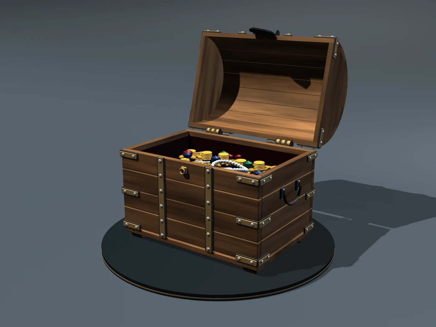 The chest with its lid open, showing coins, gemstones and a pearl strand